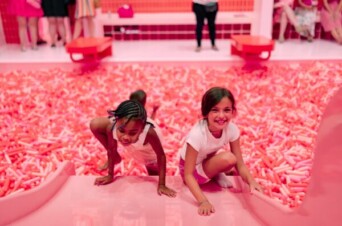 Photo - A photo of two children climbing on the slide into the Sprinkle Pool.