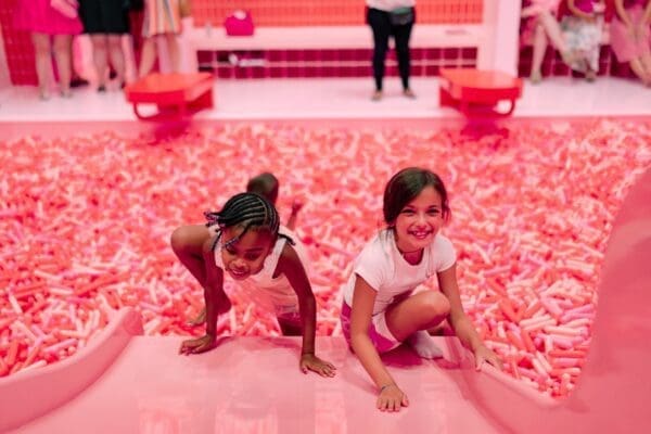 Photo - A photo of two children climbing on the slide into the Sprinkle Pool.