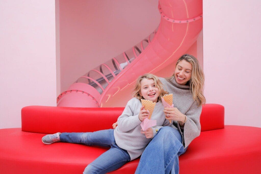 Photo - A mom and daughter eating ice cream in front of the MOIC - NYC slide