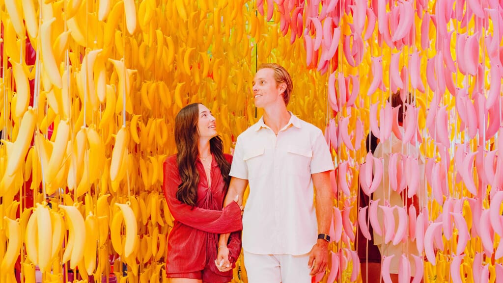 a couple enjoying the banana room at Museum of Ice Cream