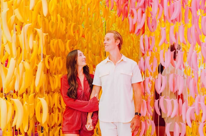 a couple enjoying the banana room at Museum of Ice Cream