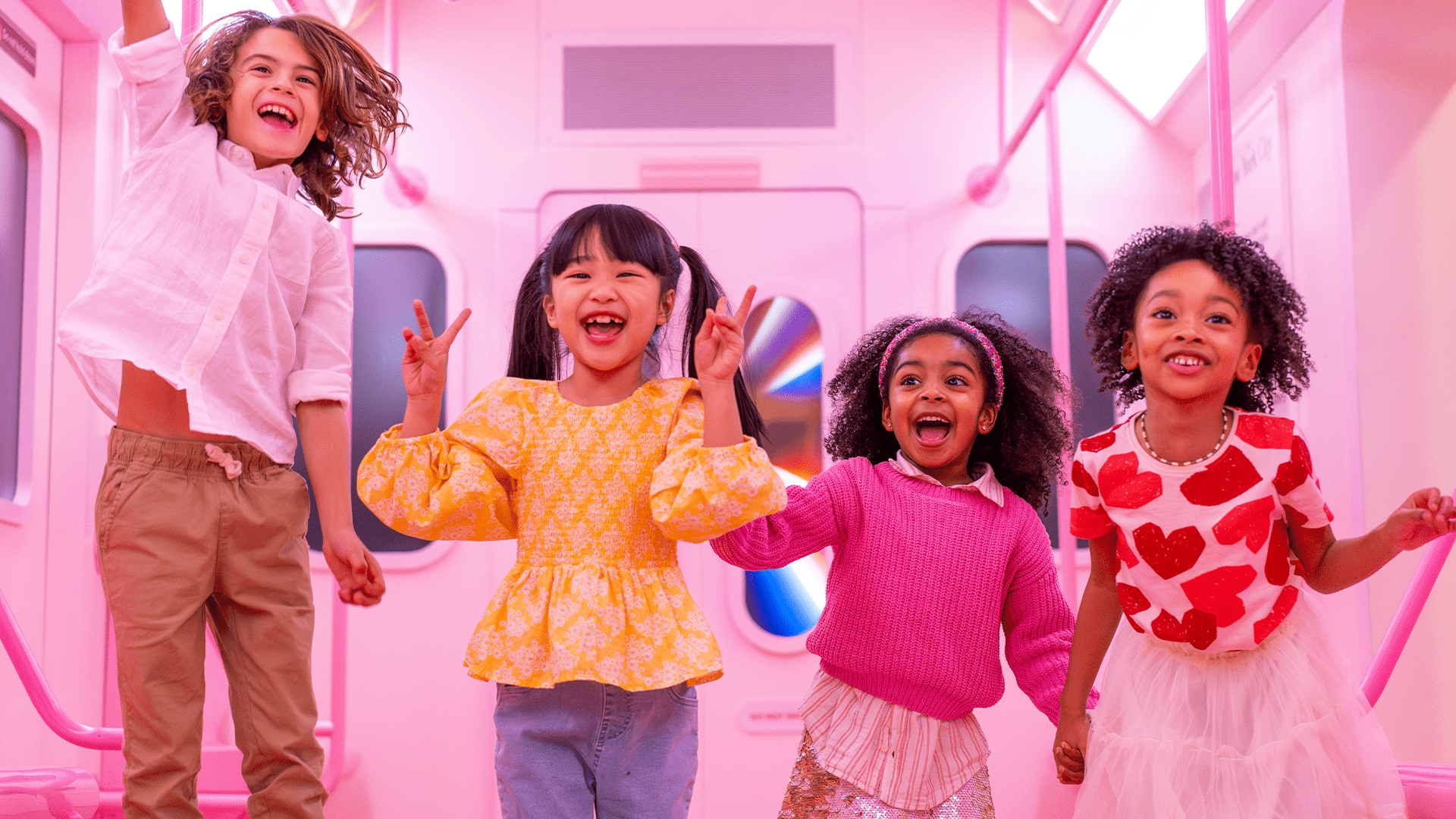 Kids enjoying the train station area at Museum of Ice Cream Miami