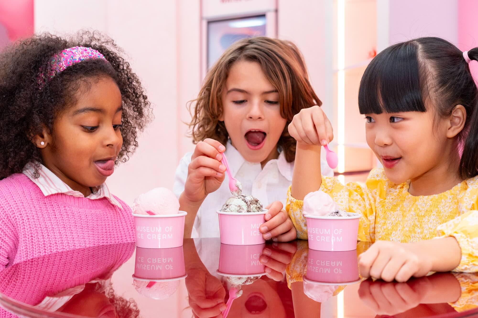 Kids tasting ice cream at Museum of Ice Cream Miami