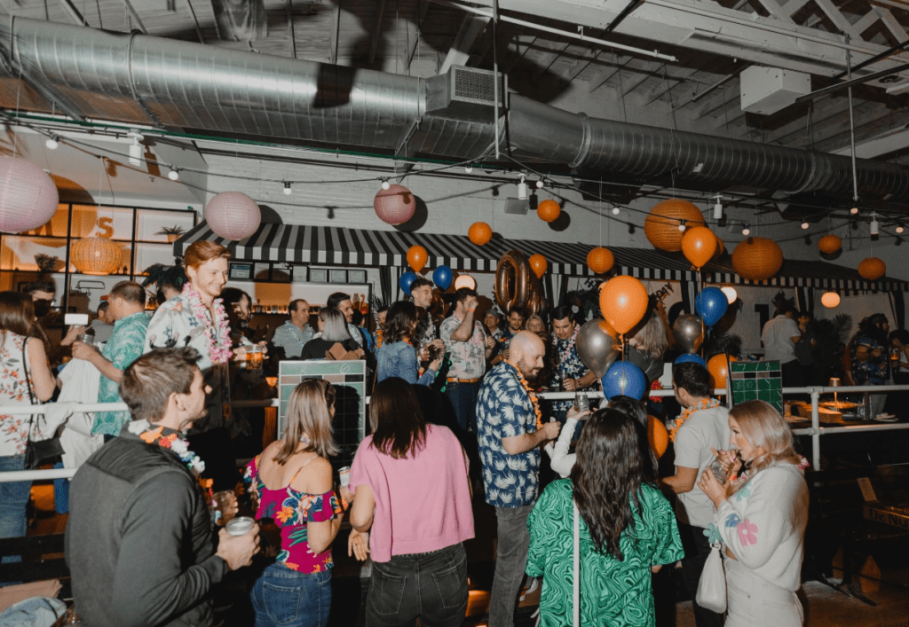 People enjoying a night out at Royal Palms Shuffleboard Club