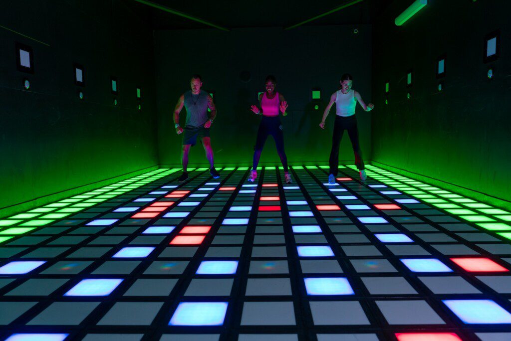 Players completing light up floor challenges at Activate Chicago