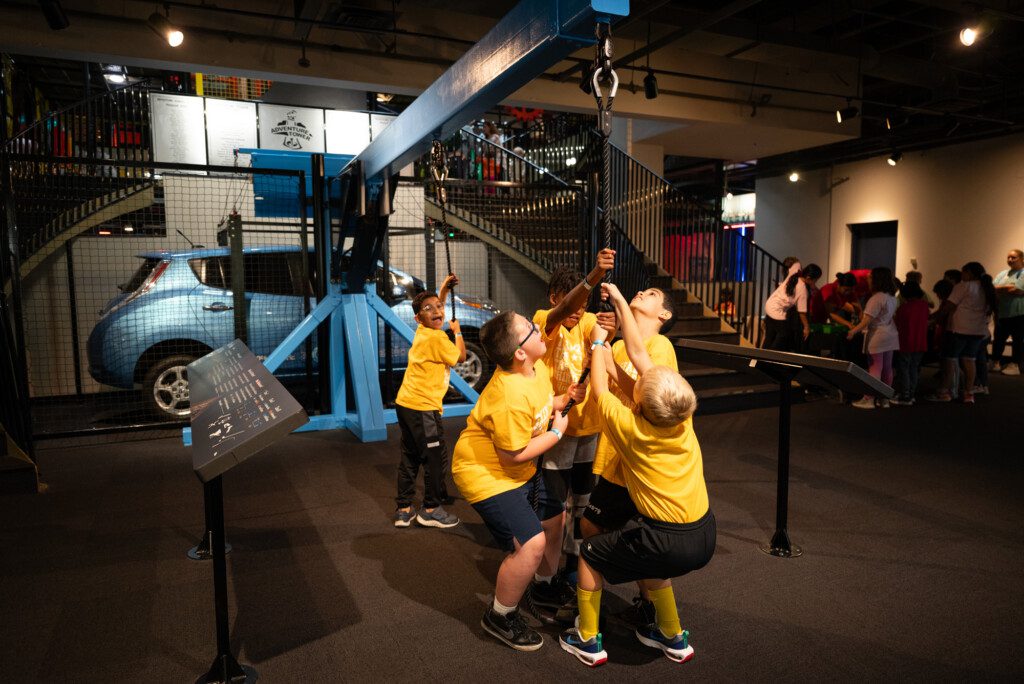 Kids exploring a hands on exhibit at Adventure Science Center
