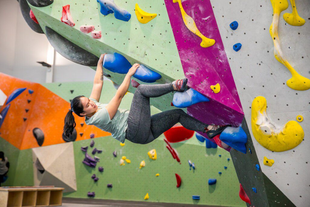 Person rock climbing at Movement Gyms