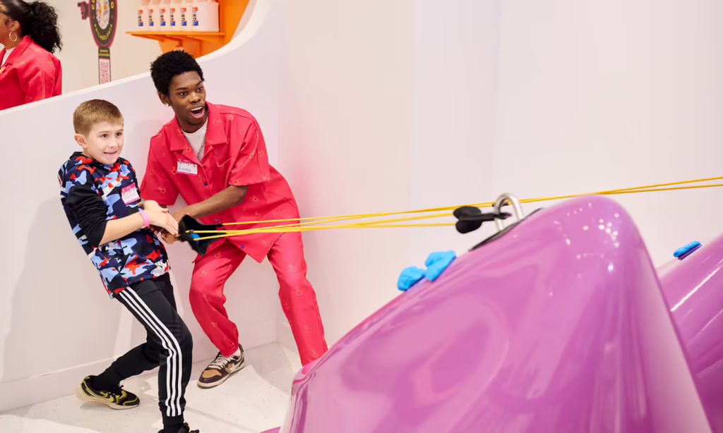 Kids enjoying colorful sensory play at Sloomoo Institute