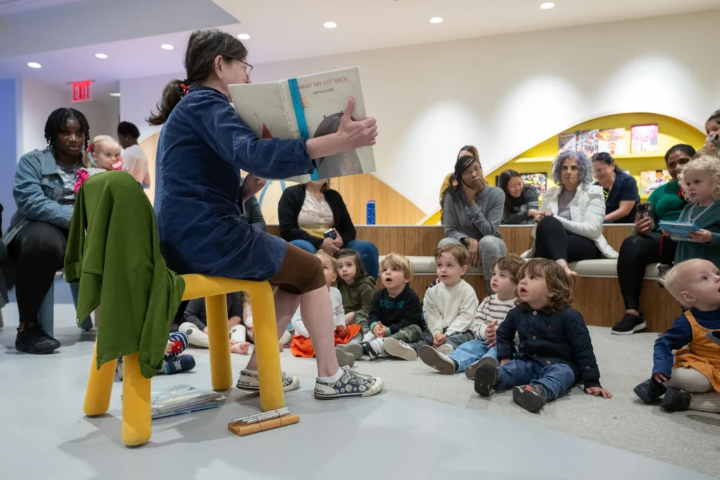 Toddlers listening to storytime at 81st Street Studio